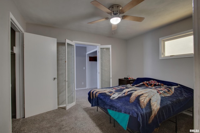 bedroom featuring french doors, ceiling fan, and carpet floors