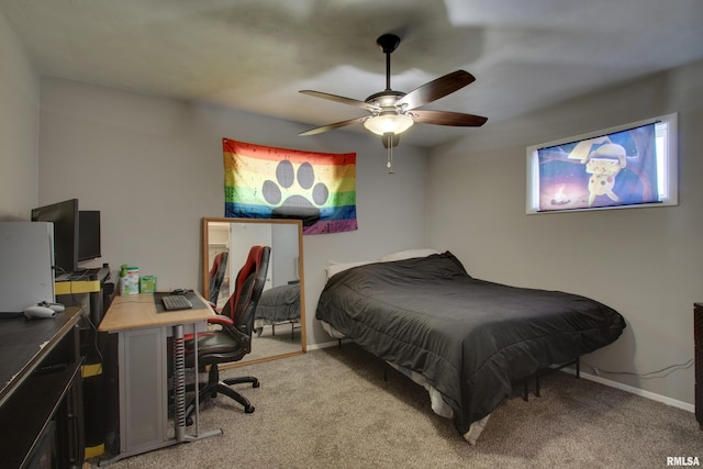 bedroom featuring ceiling fan and light carpet