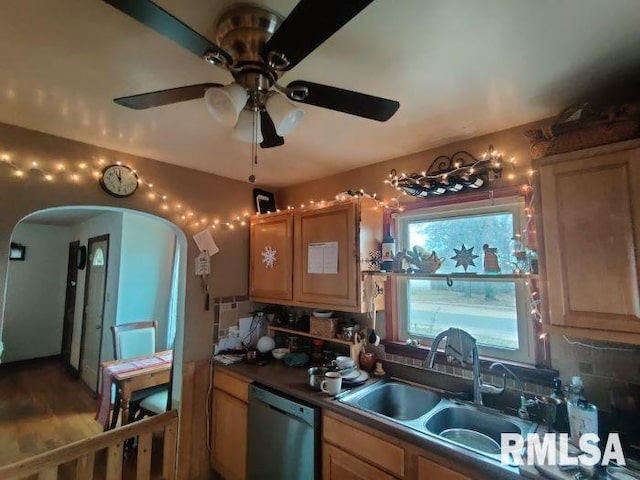 kitchen featuring ceiling fan, stainless steel dishwasher, tasteful backsplash, and sink