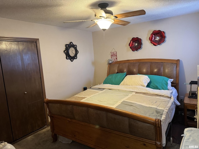 carpeted bedroom with ceiling fan, a textured ceiling, and a closet