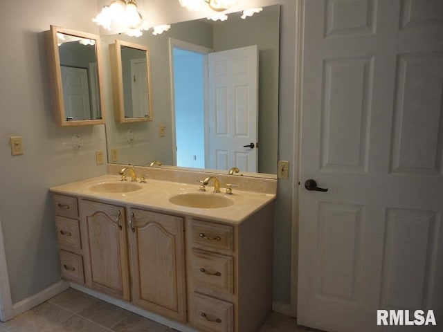 bathroom with tile patterned floors and vanity