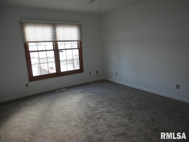 empty room featuring ceiling fan and carpet floors