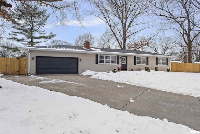 ranch-style home with a garage