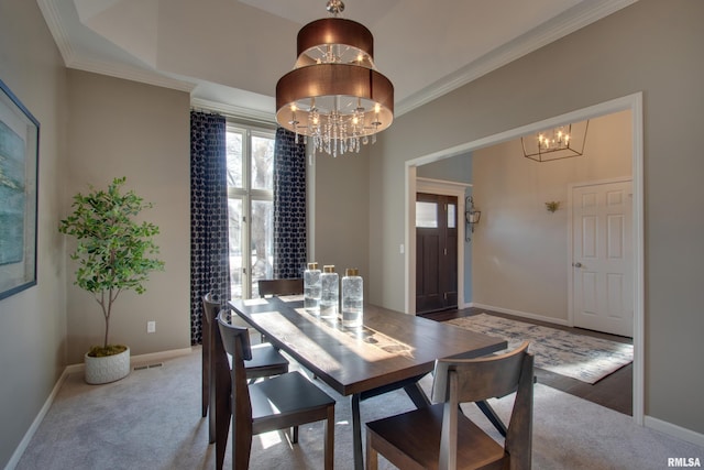 carpeted dining room with crown molding and an inviting chandelier