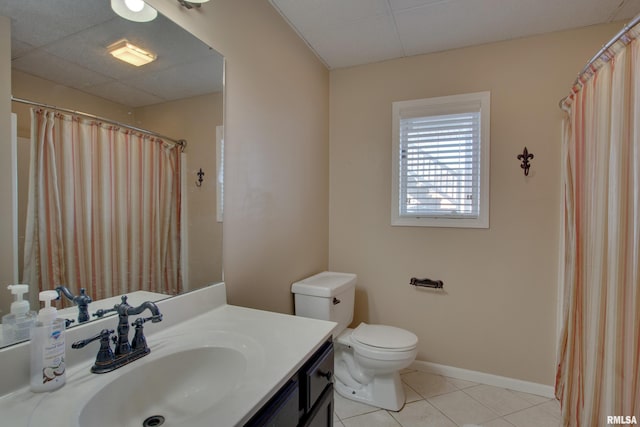 bathroom featuring tile patterned floors, vanity, and toilet