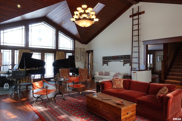 living room featuring hardwood / wood-style floors, beamed ceiling, french doors, a notable chandelier, and high vaulted ceiling