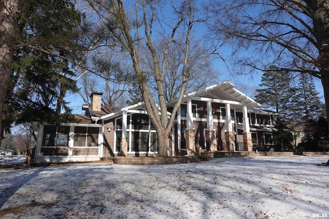 view of front facade with a sunroom