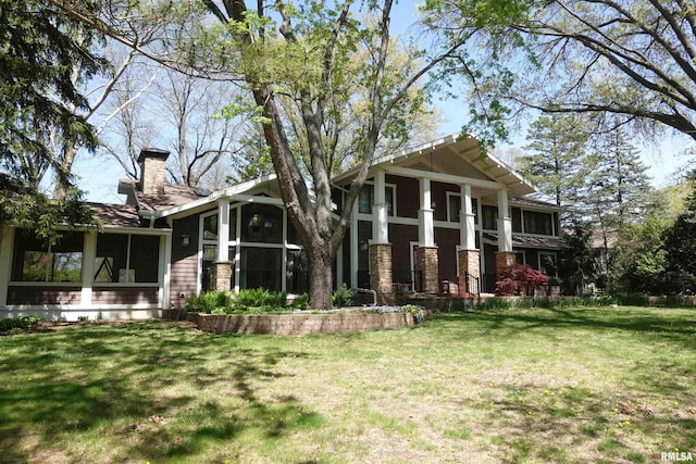 128 N Soangetaha Rd, Galesburg, IL 61401 - neoclassical home with a chimney and a front yard