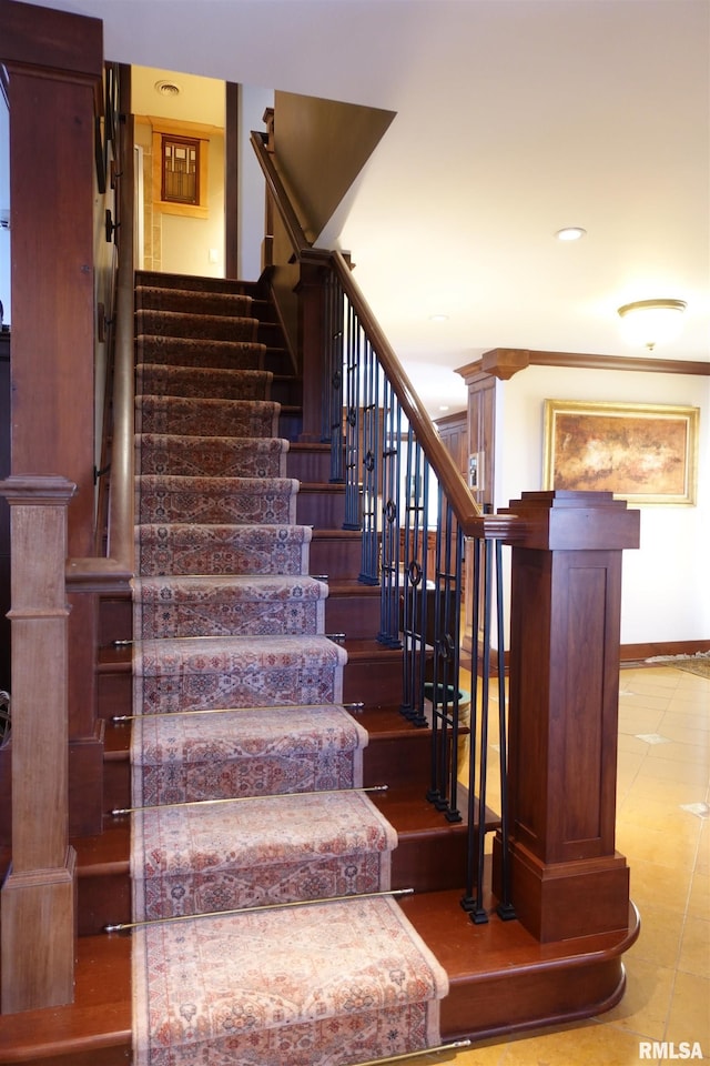 stairs with tile patterned flooring