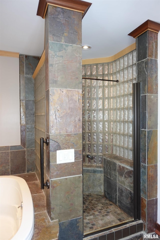 bathroom with separate shower and tub