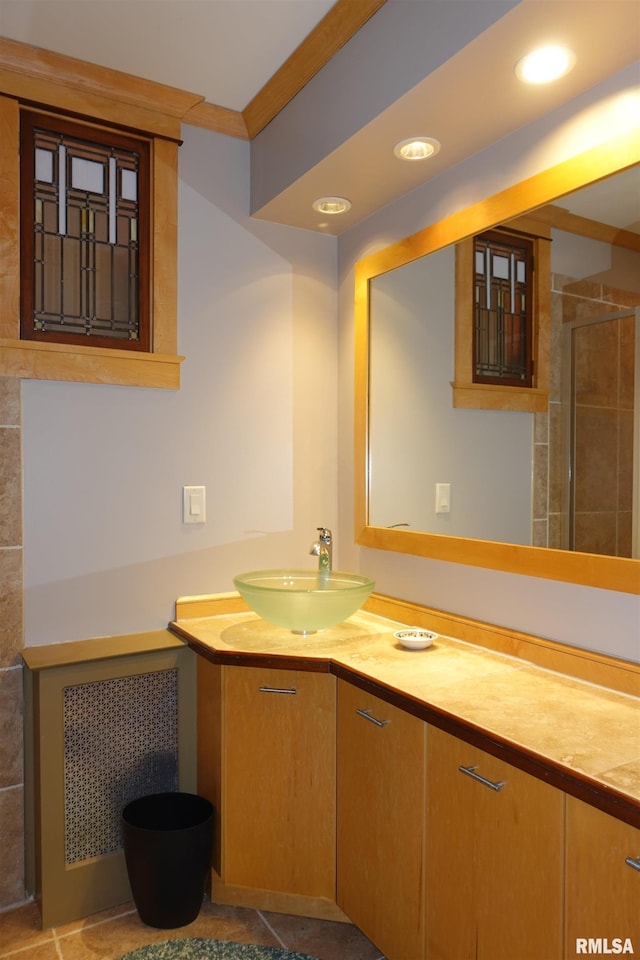 bathroom with vanity and ornamental molding