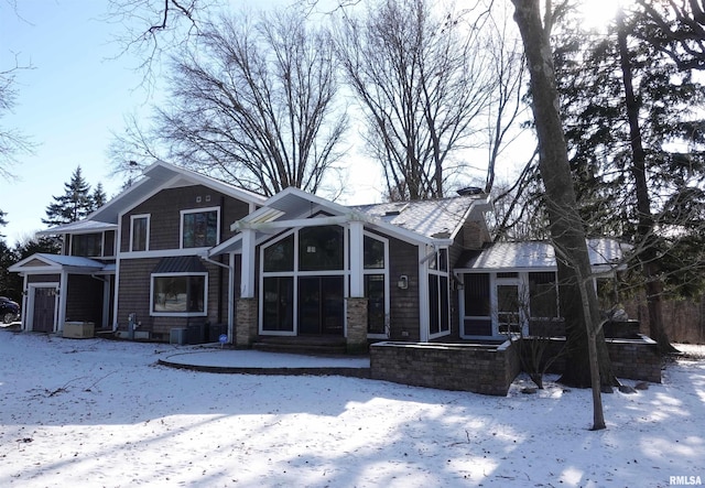 view of front of home with a sunroom