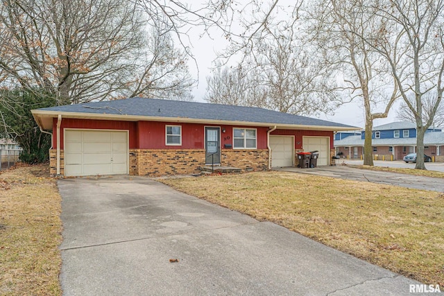 ranch-style home with a garage and a front yard