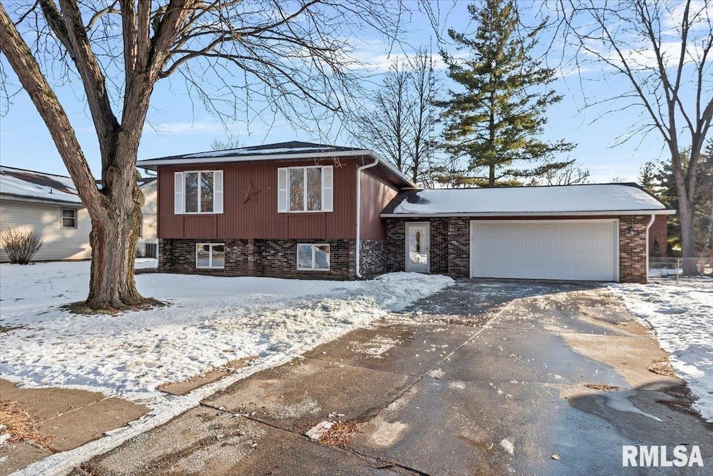 split level home with a garage