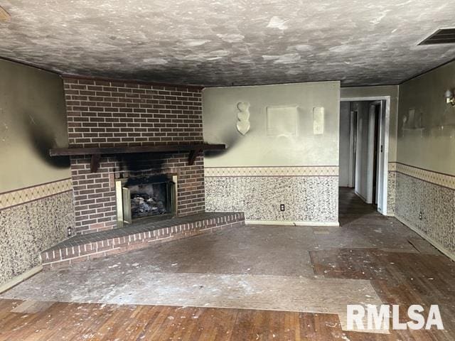 unfurnished living room with a fireplace