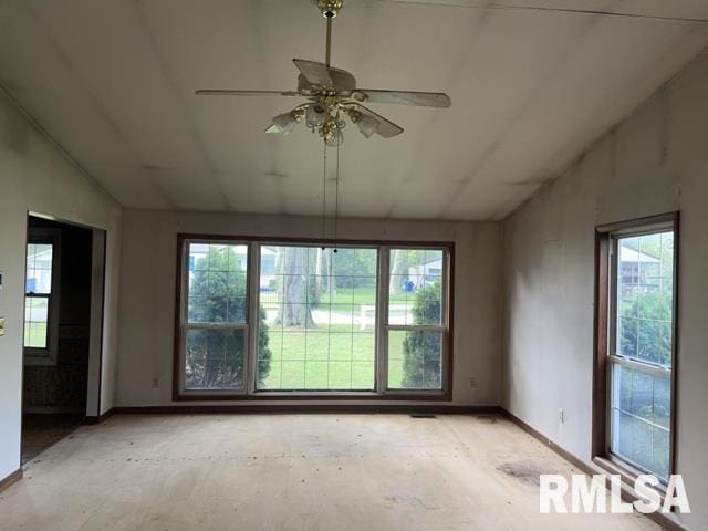 spare room featuring ceiling fan and lofted ceiling