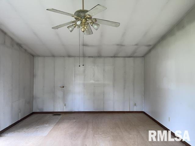 unfurnished room with ceiling fan and hardwood / wood-style flooring