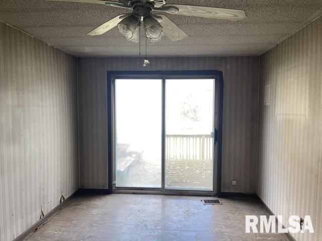 unfurnished room featuring ceiling fan