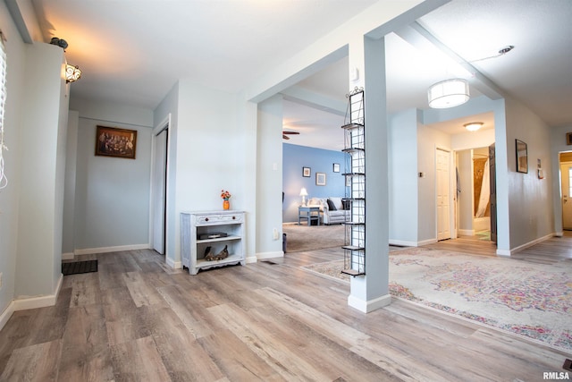 corridor featuring wood-type flooring