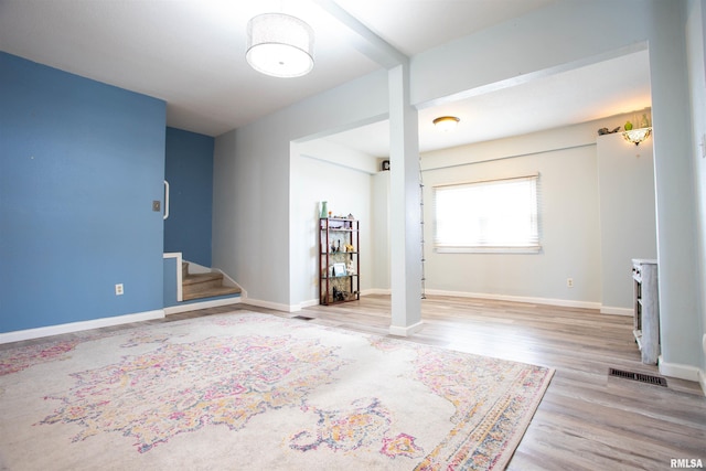 spare room with light hardwood / wood-style floors