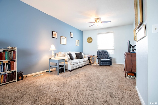 carpeted living room featuring ceiling fan