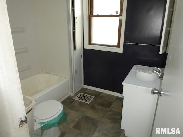 full bathroom with toilet, vanity, and shower / washtub combination