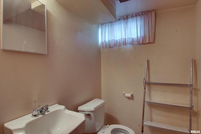 bathroom featuring sink and toilet