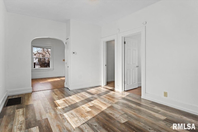 spare room featuring hardwood / wood-style flooring