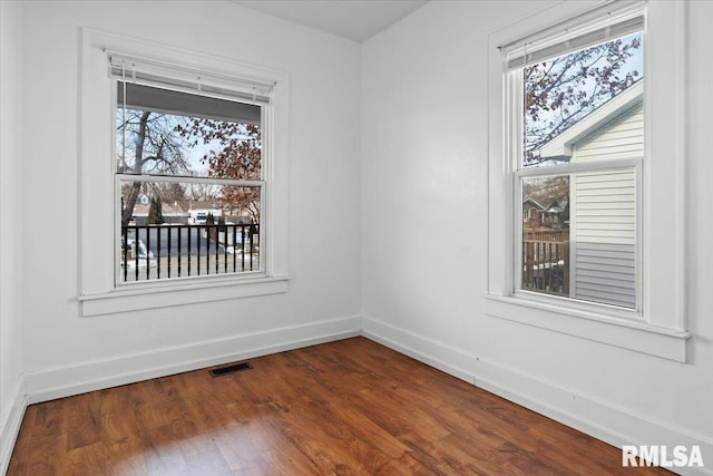 empty room featuring dark hardwood / wood-style floors