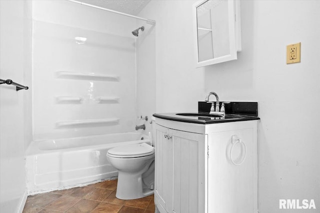 full bathroom with toilet, washtub / shower combination, a textured ceiling, and vanity