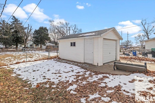 view of snow covered garage