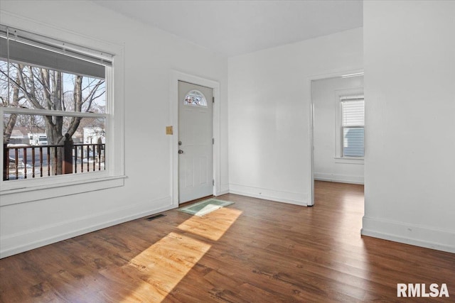 foyer entrance featuring dark hardwood / wood-style floors