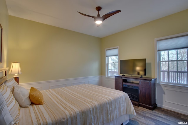 bedroom featuring light hardwood / wood-style floors and ceiling fan