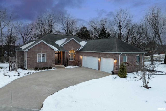 ranch-style home featuring a garage