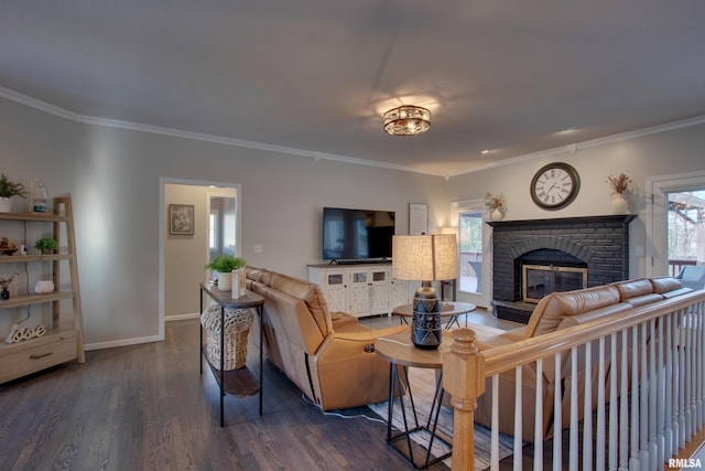 living room with a brick fireplace, crown molding, and dark wood-type flooring