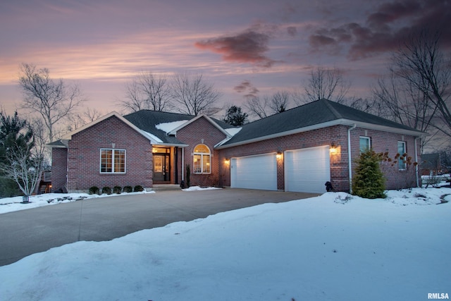 ranch-style home featuring a garage