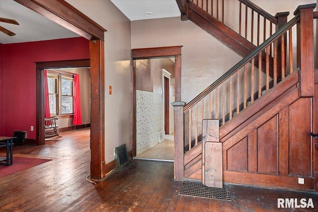 foyer with ceiling fan and dark hardwood / wood-style flooring