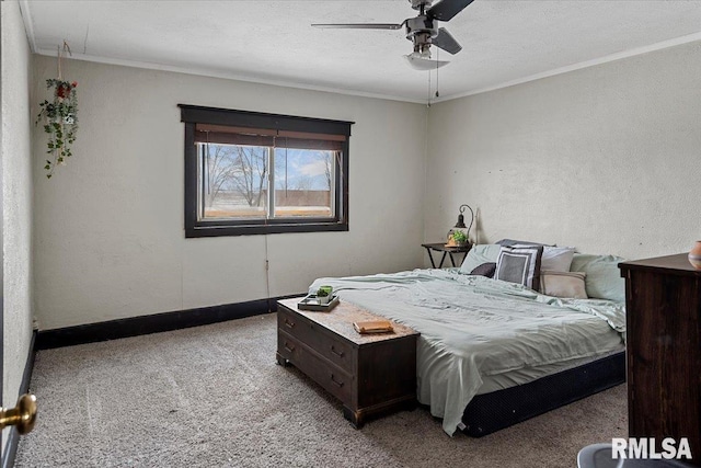 bedroom featuring crown molding, light colored carpet, and ceiling fan