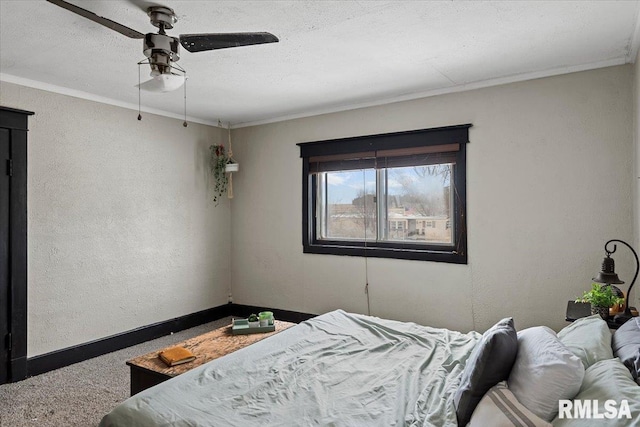 bedroom featuring a textured ceiling, ceiling fan, and ornamental molding