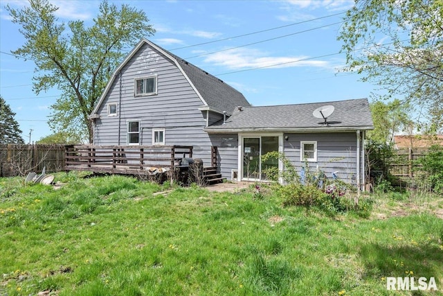 406 W Elm St, Buffalo, IL 62515 - back of house featuring fence, a wooden deck, a shingled roof, a gambrel roof, and a yard