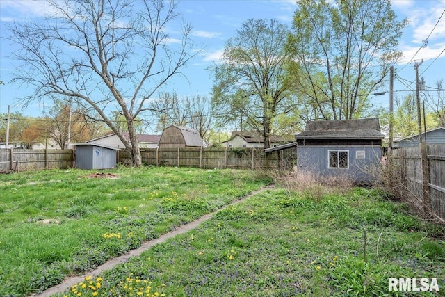 406 W Elm St, Buffalo, IL 62515 - view of yard featuring a fenced backyard, a storage unit, and an outdoor structure