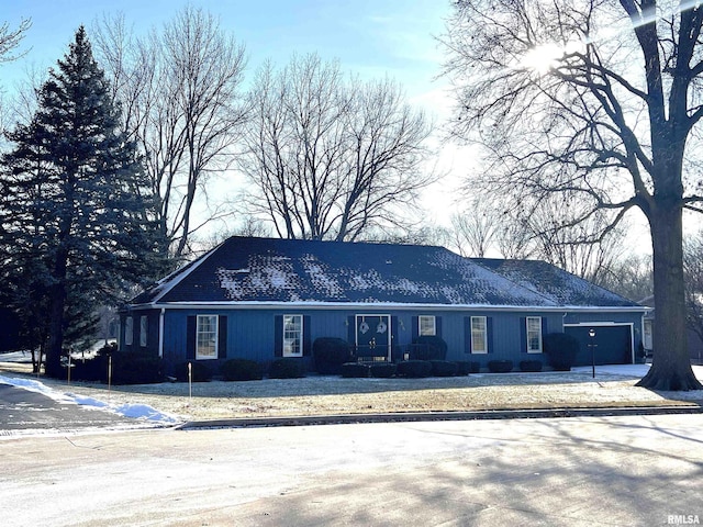 single story home featuring a garage