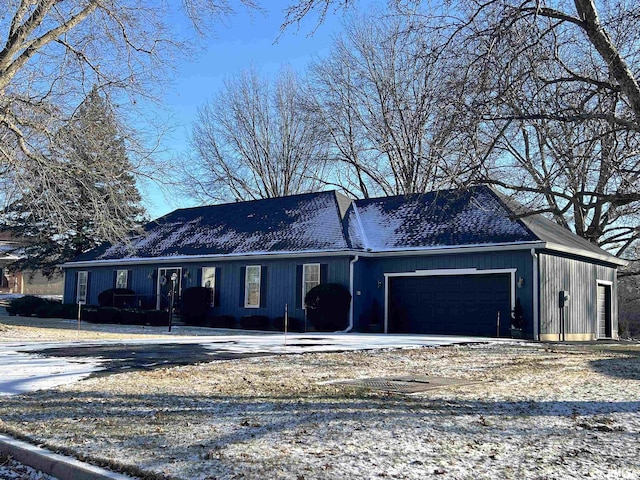 ranch-style house featuring a garage