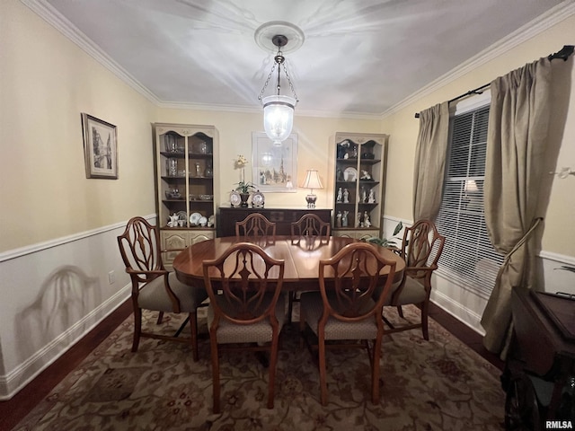 dining room featuring crown molding and dark hardwood / wood-style flooring