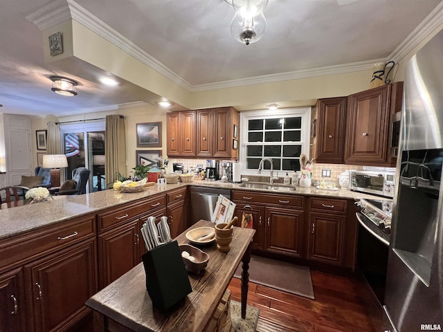 kitchen featuring sink, stainless steel appliances, crown molding, and dark hardwood / wood-style flooring