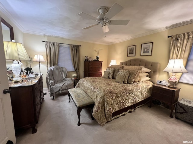 bedroom featuring ceiling fan, ornamental molding, and light carpet