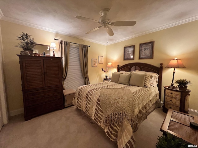 carpeted bedroom with ceiling fan and ornamental molding