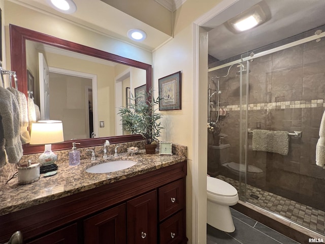 bathroom featuring toilet, an enclosed shower, tile patterned floors, and vanity