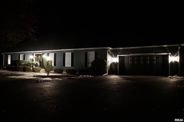 ranch-style home featuring a garage