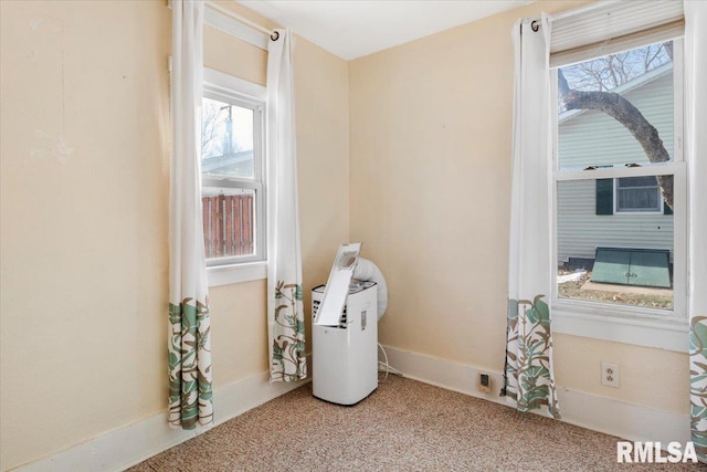 interior space featuring a healthy amount of sunlight and carpet floors